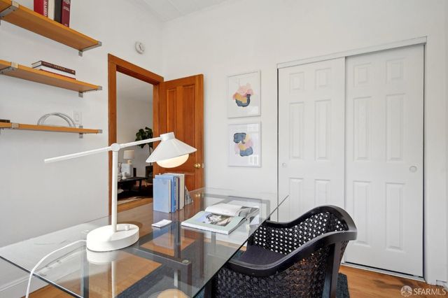 a living room with furniture and a mirror