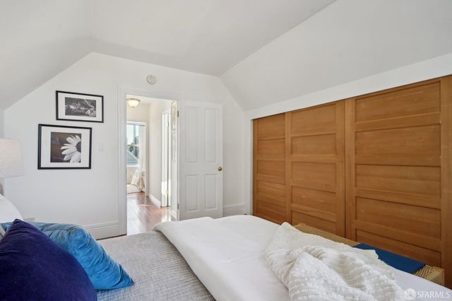 a bedroom with a bed and furniture