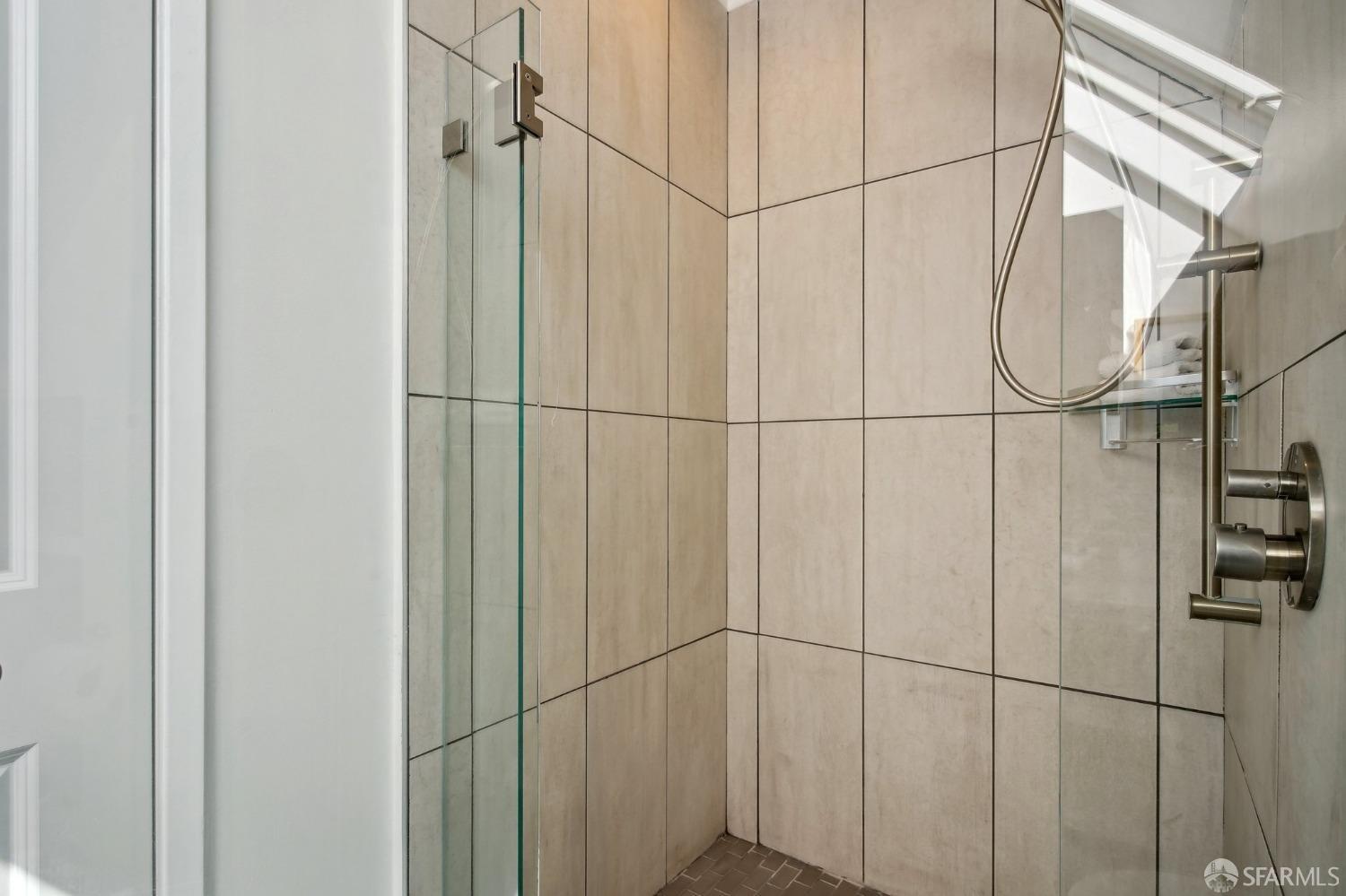 20 Wright Street San Francisco, CA 94110 - Photo 18 of 34 a bathroom with a glass shower door