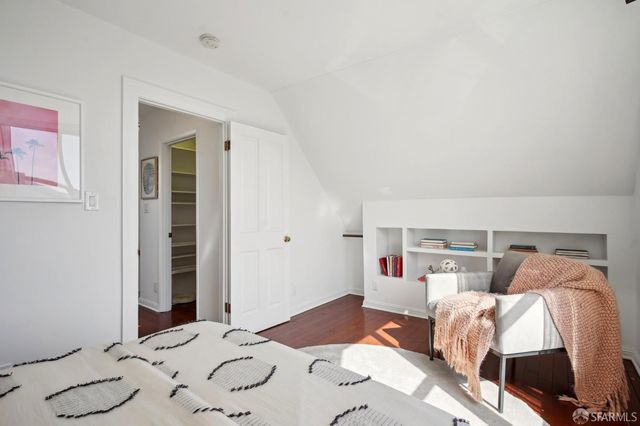 a bedroom with a bed and a closet