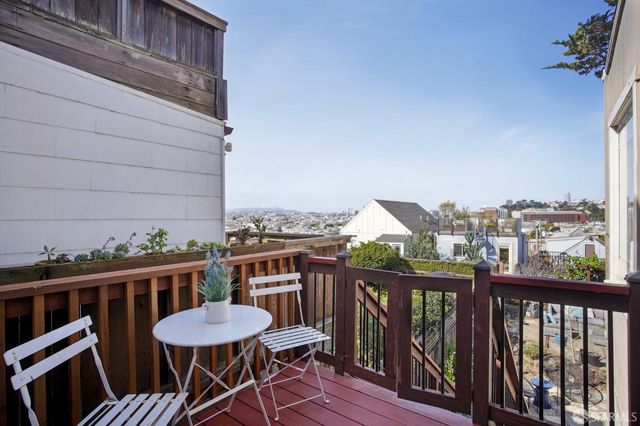 a view of a chair and table on the deck
