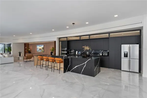 a kitchen with stainless steel appliances granite countertop a sink and a stove