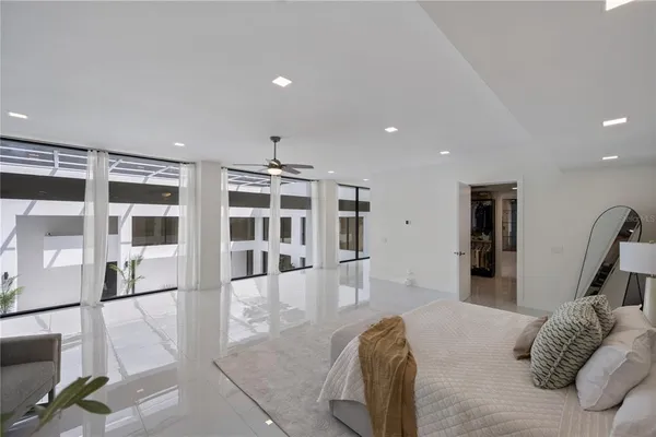 a view of a room with gym equipment and a large window