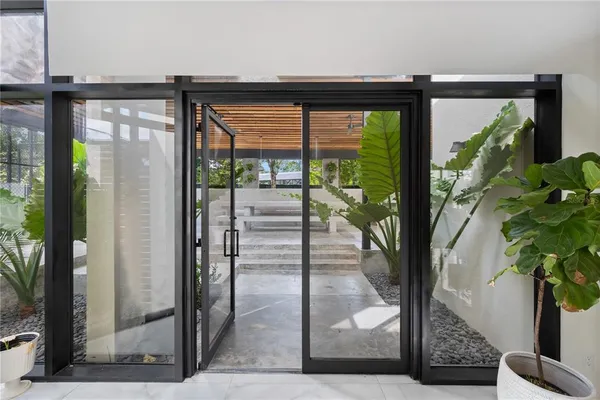 a swimming pool with outdoor seating and yard
