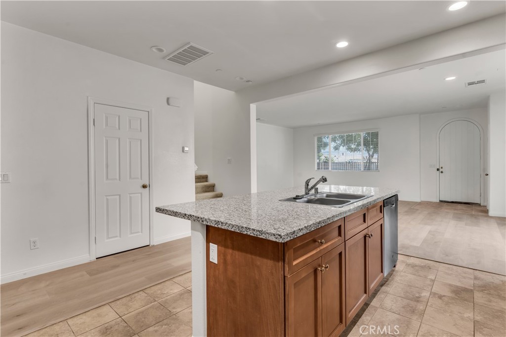 687 South Fillmore Avenue Rialto, CA 92376 - Photo 18 of 39 a kitchen with stainless steel appliances granite countertop a stove and a sink
