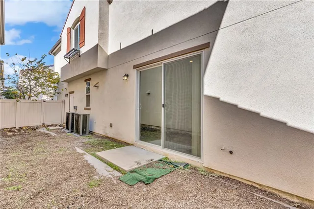 a view of a front door and outdoor space