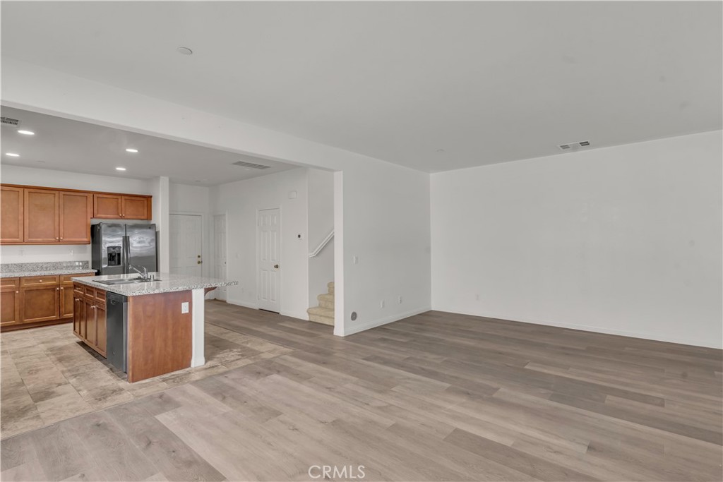 687 South Fillmore Avenue Rialto, CA 92376 - Photo 9 of 39 a view of kitchen with refrigerator stove microwave and stove