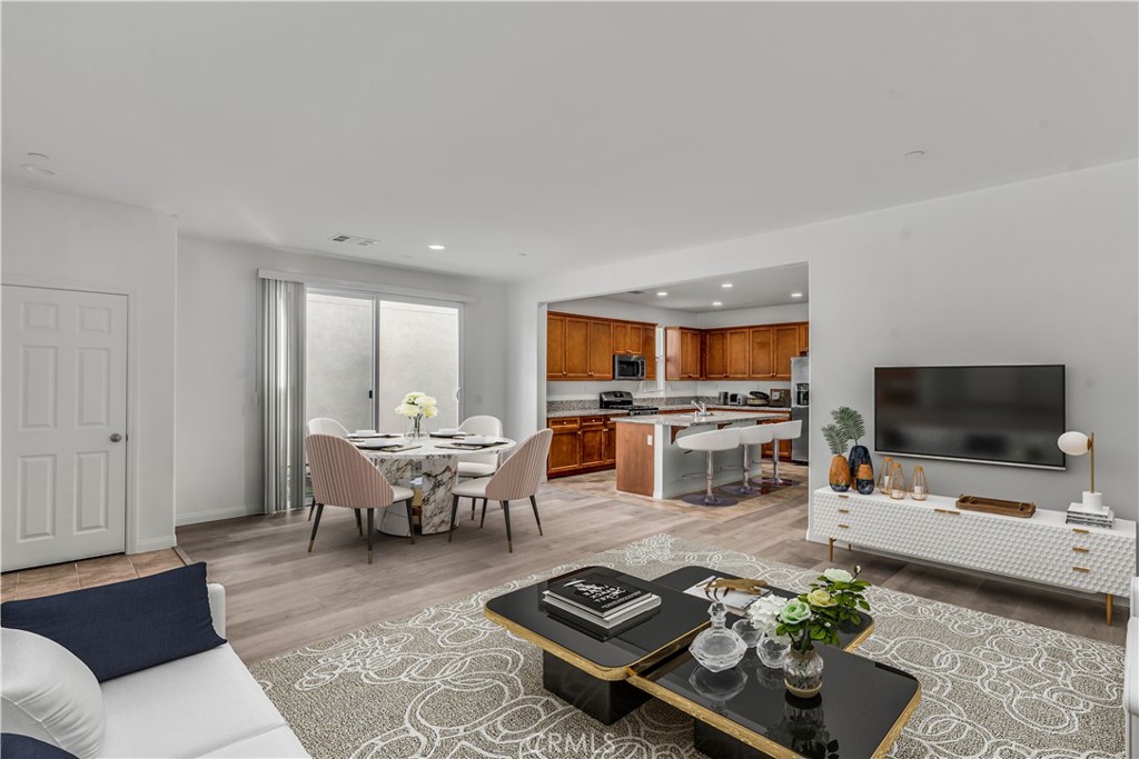 687 South Fillmore Avenue Rialto, CA 92376 - Photo 10 of 39 a living room with furniture and a flat screen tv
