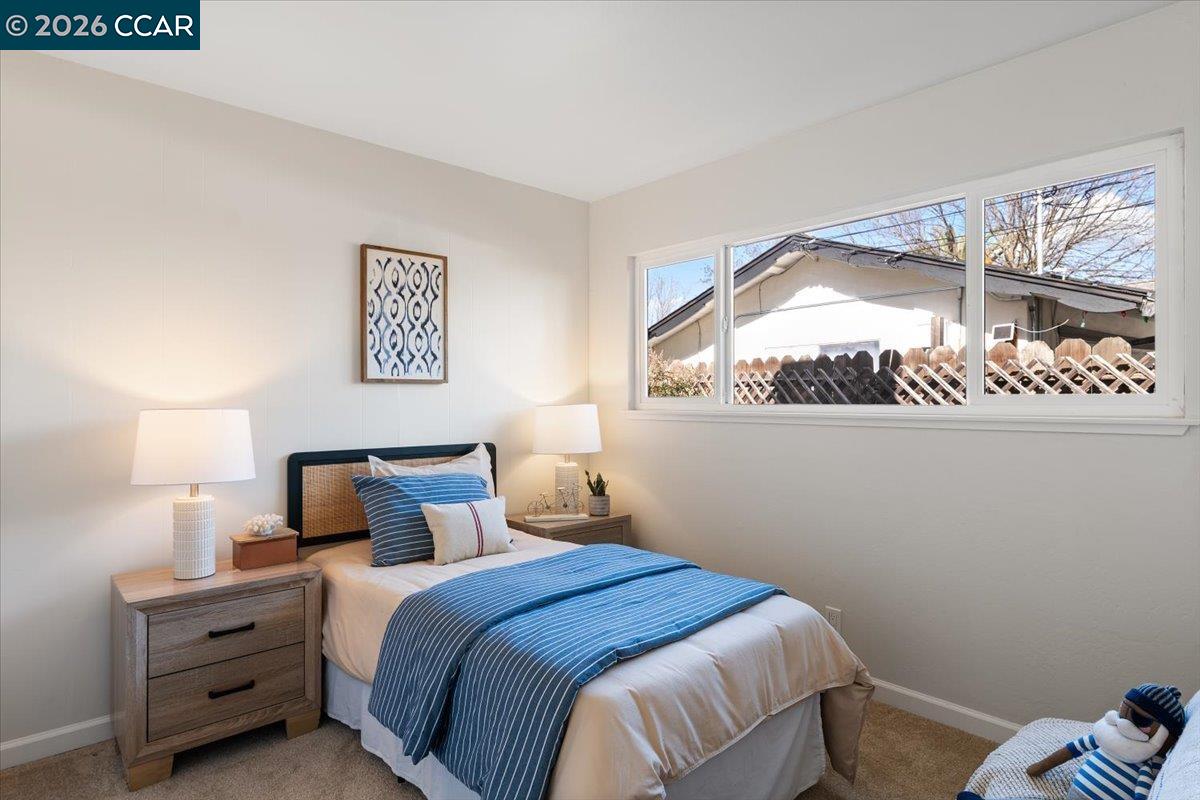 4095 Hamlet Drive Concord, CA 94521 - Photo 15 of 26 a bedroom with a bed and a night stand