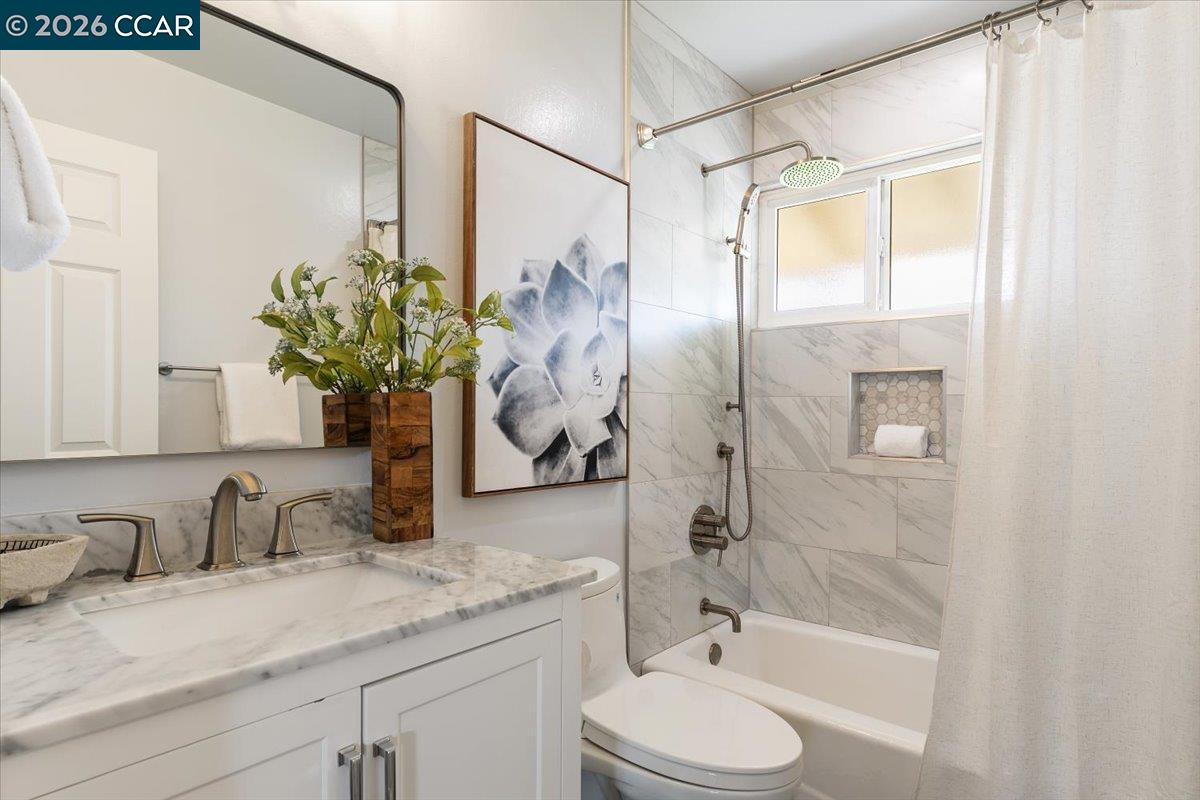 4095 Hamlet Drive Concord, CA 94521 - Photo 16 of 26 a bathroom with a granite countertop sink toilet and shower