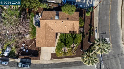 an aerial view of a house with a garden