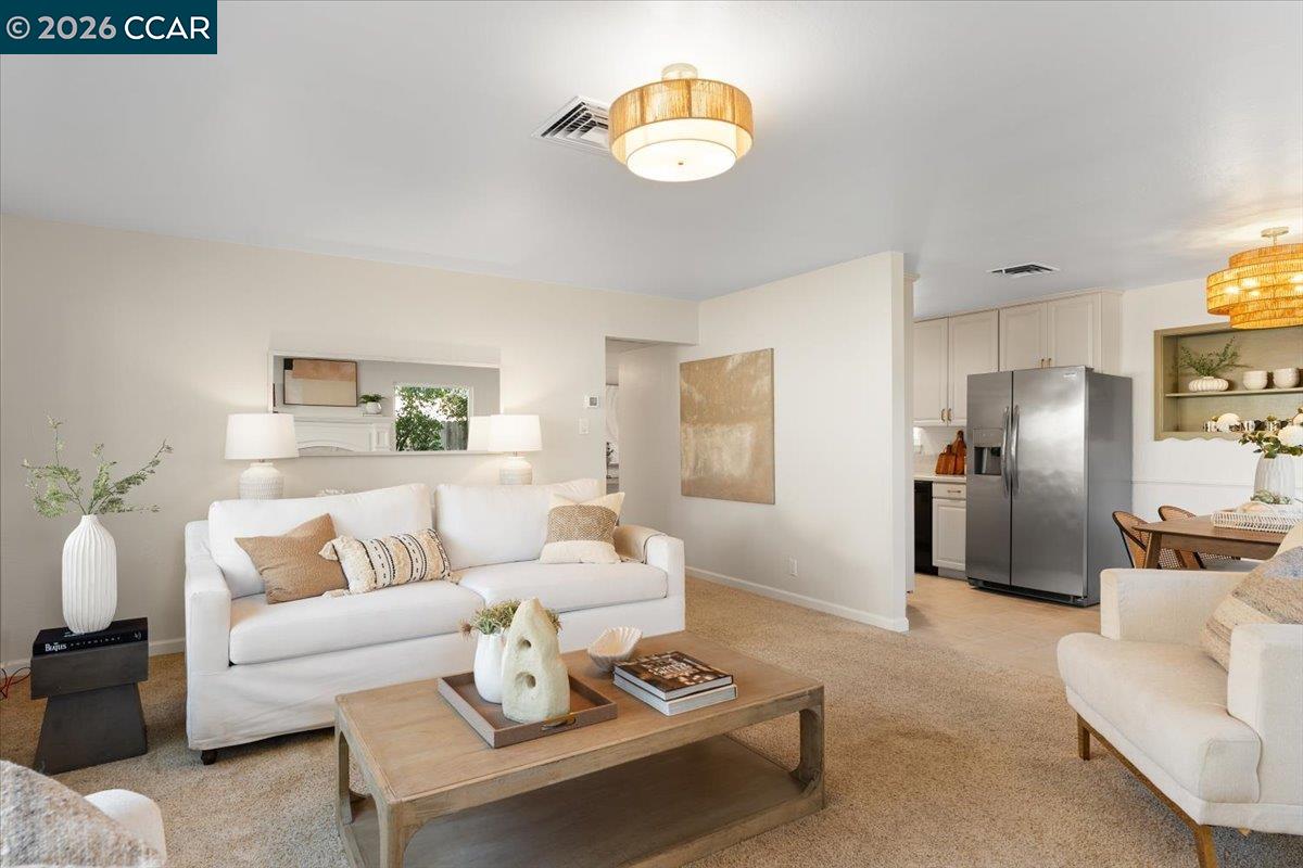 4095 Hamlet Drive Concord, CA 94521 - Photo 4 of 26 a living room with furniture and a chandelier