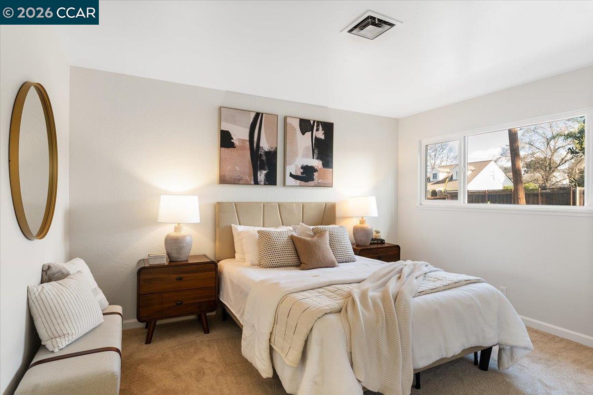 4095 Hamlet Drive Concord, CA 94521 - Photo 10 of 26 a bedroom with a bed and a couch