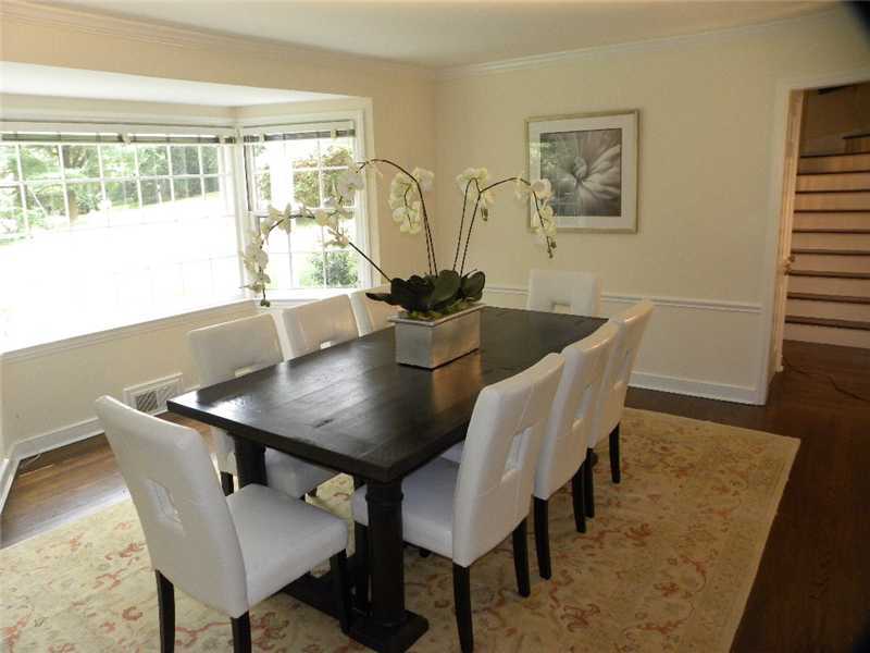 67 Peach Hill Road Darien, CT 06820 - Photo 12 of 25 a view of a dining room with furniture and wooden floor