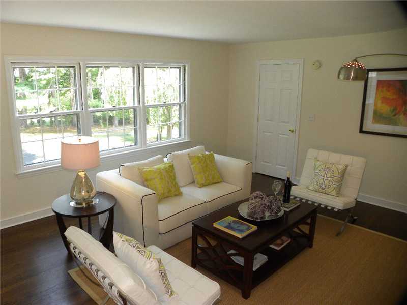 67 Peach Hill Road Darien, CT 06820 - Photo 13 of 25 a living room with furniture and a large window