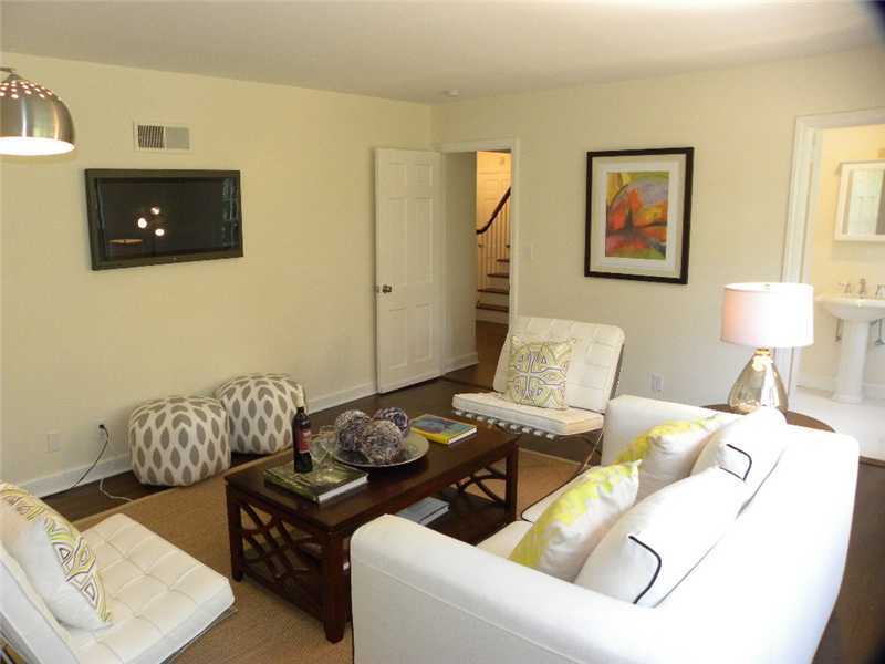 67 Peach Hill Road Darien, CT 06820 - Photo 14 of 25 a living room with furniture and a lamp