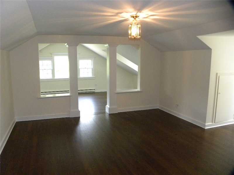 67 Peach Hill Road Darien, CT 06820 - Photo 17 of 25 a view of an empty room with wooden floor and a window