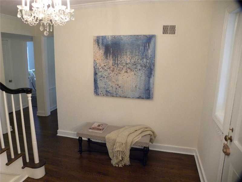 67 Peach Hill Road Darien, CT 06820 - Photo 22 of 25 a room with a table and a chandelier