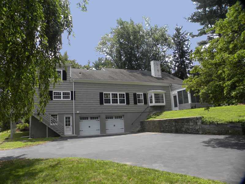 67 Peach Hill Road Darien, CT 06820 - Photo 24 of 25 front view of a house with a yard
