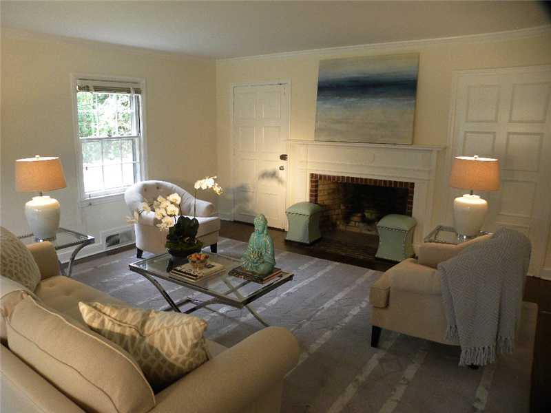 67 Peach Hill Road Darien, CT 06820 - Photo 4 of 25 a living room with furniture a fireplace and a window