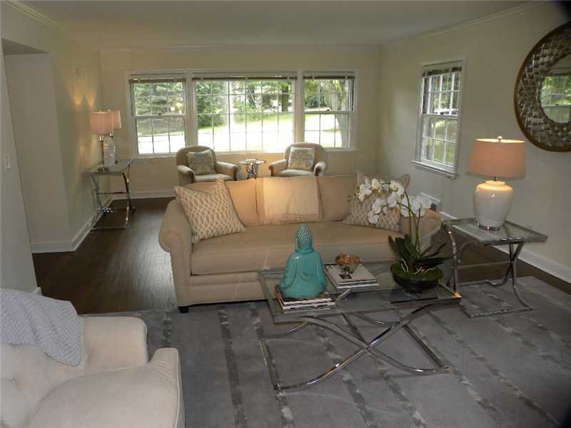 67 Peach Hill Road Darien, CT 06820 - Photo 5 of 25 a living room with furniture and a large window