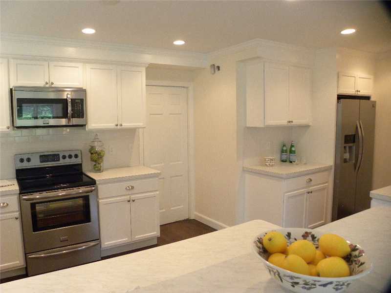 67 Peach Hill Road Darien, CT 06820 - Photo 8 of 25 a kitchen with a sink stove and refrigerator