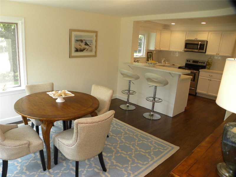 67 Peach Hill Road Darien, CT 06820 - Photo 9 of 25 a view of a dining room with furniture and wooden floor