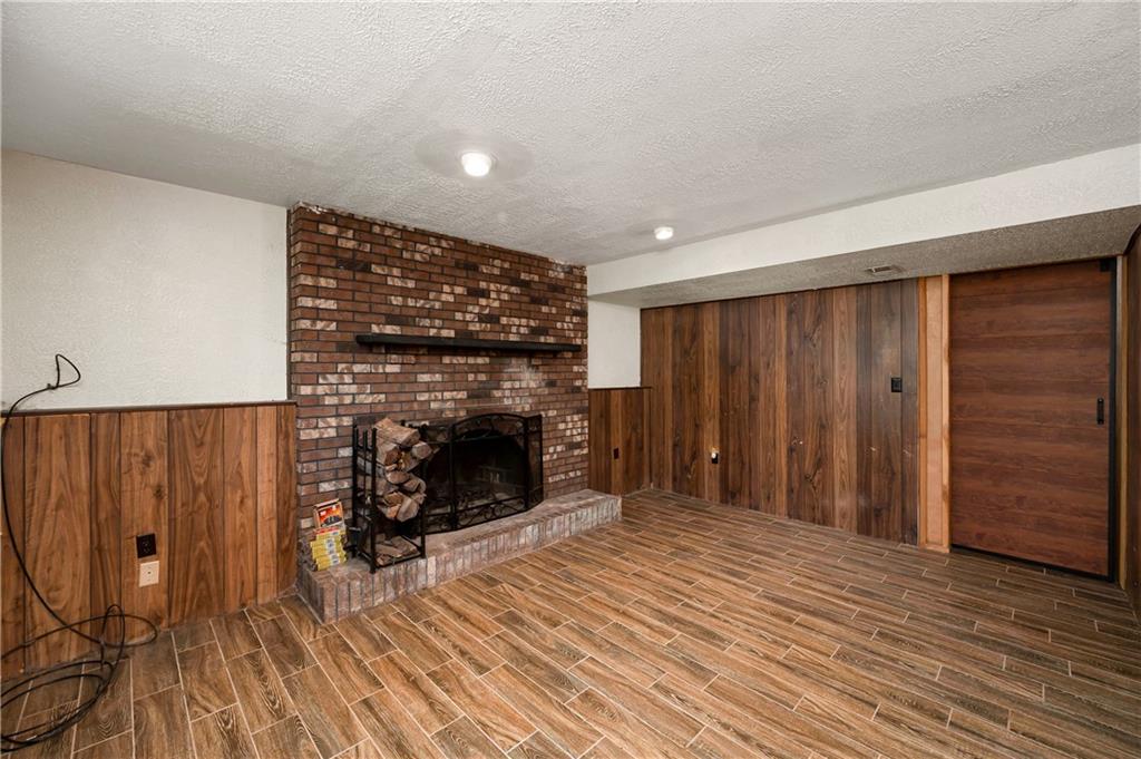 201 Colleen Street Butler, PA 16001 - Photo 29 of 33 a view of a livingroom with wooden floor and a fireplace