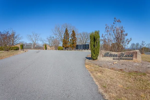 a view of a road with tall buildings in the background