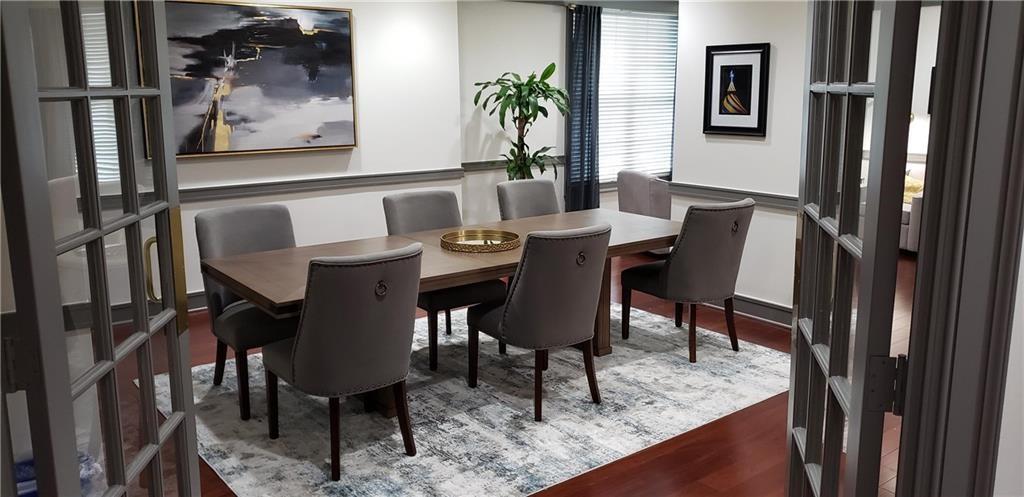 1101 Juniper Street Northeast, Unit 1416 Atlanta, GA 30309 - Photo 34 of 48 a view of a dining room with furniture