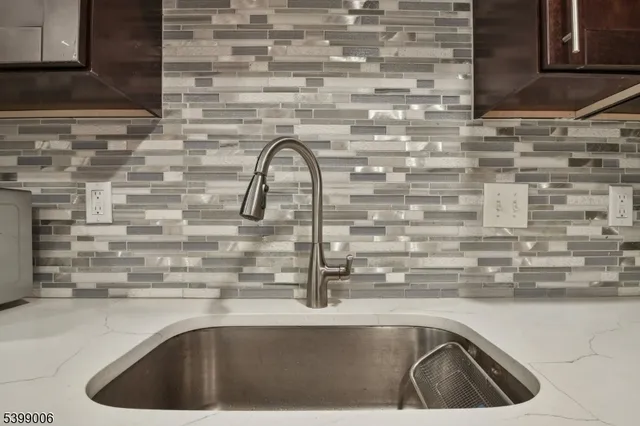 a kitchen with a sink and a stove