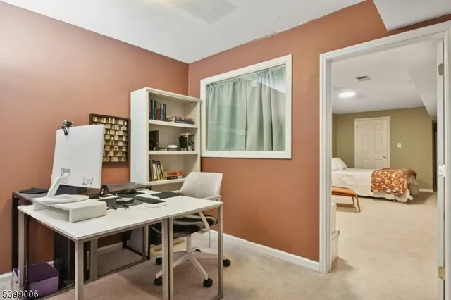 a workspace with furniture and window