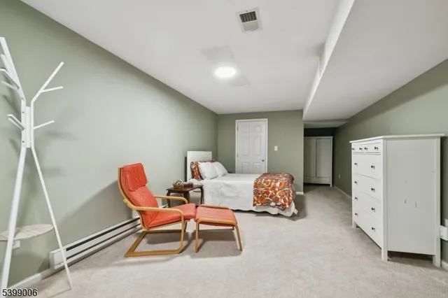 a bedroom with furniture and windows