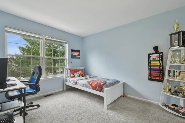 a room with a bed and a window