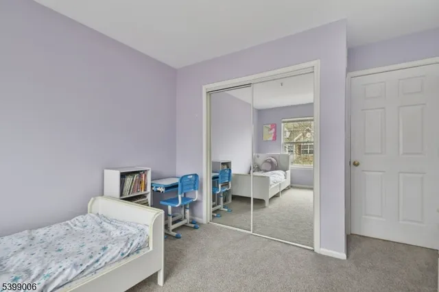 a bedroom with a bed and a table in it