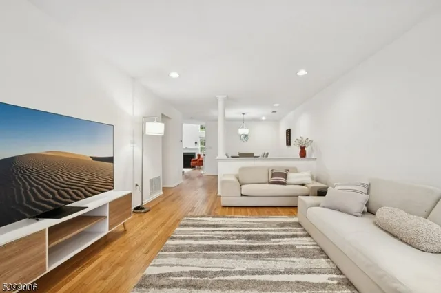 a large white bed in a white room