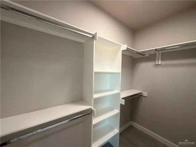 a view of an empty walk in closet
