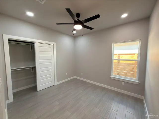 a view of an empty room with a window
