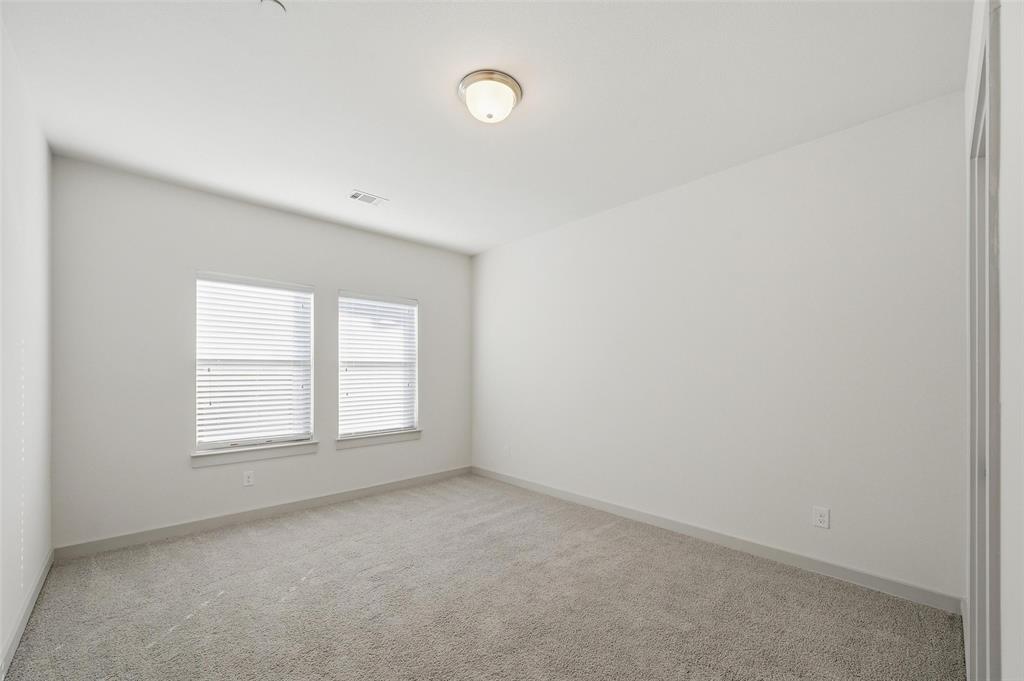 4836 Paddock Trail Carrollton, TX 75010 - Photo 18 of 25 an empty room with windows