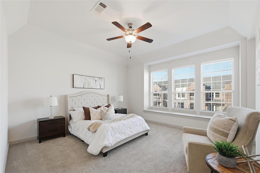 4836 Paddock Trail Carrollton, TX 75010 - Photo 20 of 25 a bed room with a bed and a couch