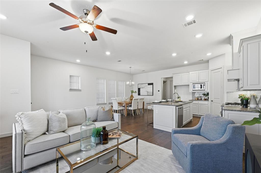 4836 Paddock Trail Carrollton, TX 75010 - Photo 3 of 25 a living room with furniture kitchen view and a dining table