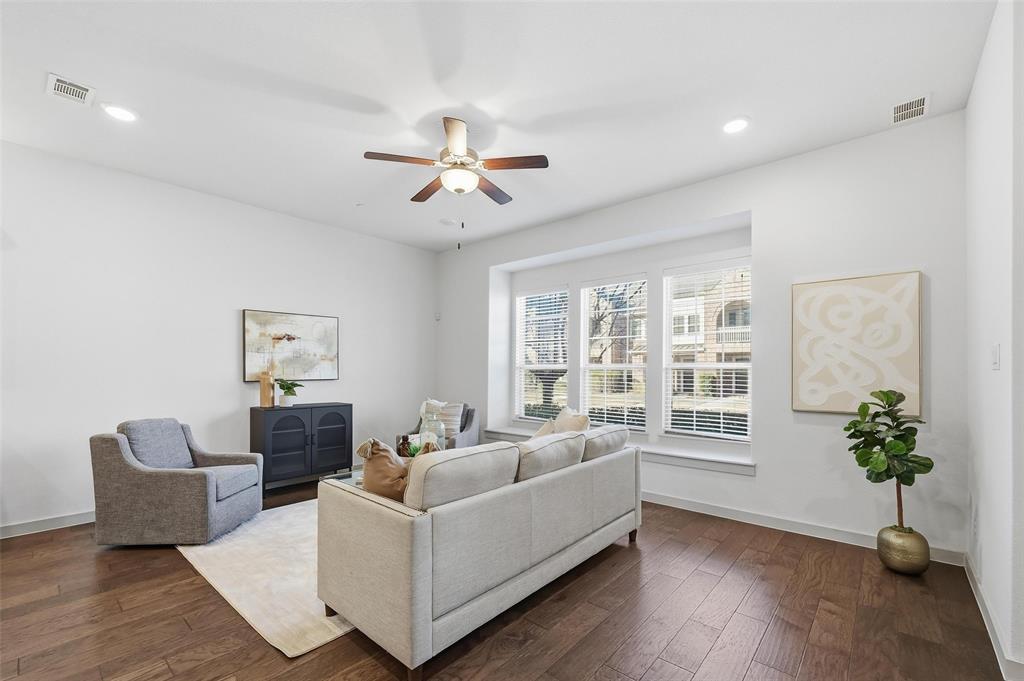 4836 Paddock Trail Carrollton, TX 75010 - Photo 5 of 25 a living room with furniture a potted plant and a window