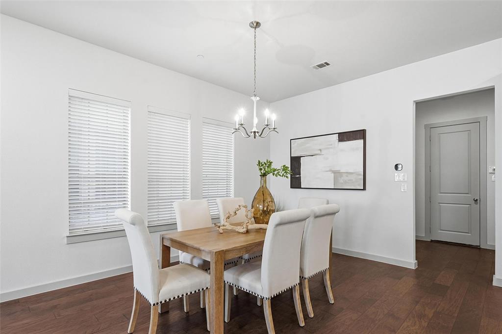 4836 Paddock Trail Carrollton, TX 75010 - Photo 7 of 25 a view of a dining room with furniture window and wooden floor