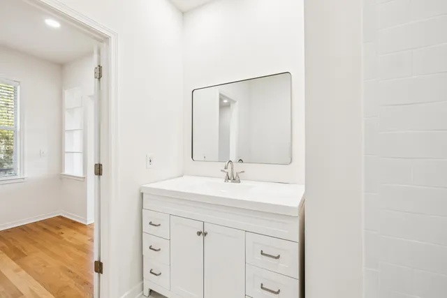 a bathroom with a sink and a mirror