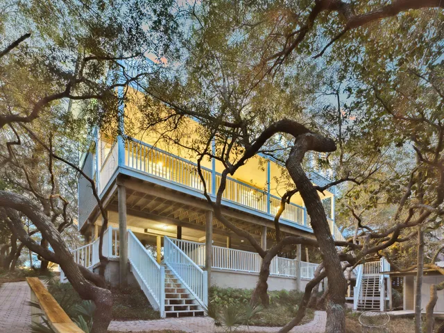 a backyard of a house with lots of trees