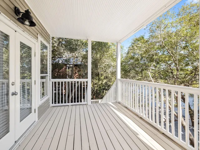 a view of a two chairs in the balcony