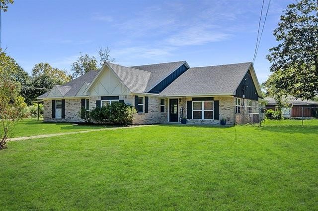 545 Elm Street Sour Lake, TX 77659 - Photo 11 of 15 a front view of a house with a garden