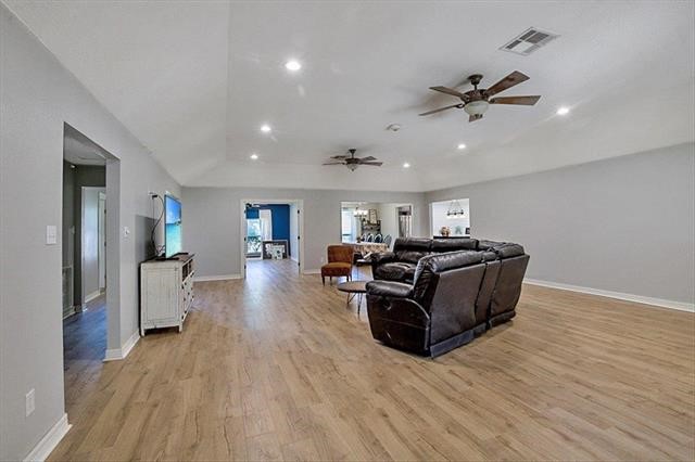 545 Elm Street Sour Lake, TX 77659 - Photo 15 of 15 a living room with furniture and a wooden floor