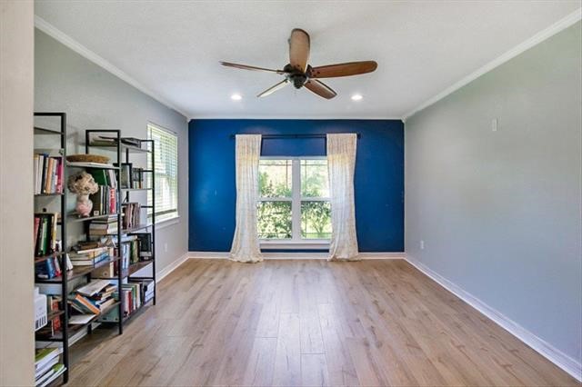 545 Elm Street Sour Lake, TX 77659 - Photo 7 of 15 a view of a livingroom with wooden floor and a window