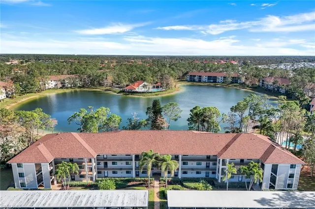 an aerial view of a house with a lake view
